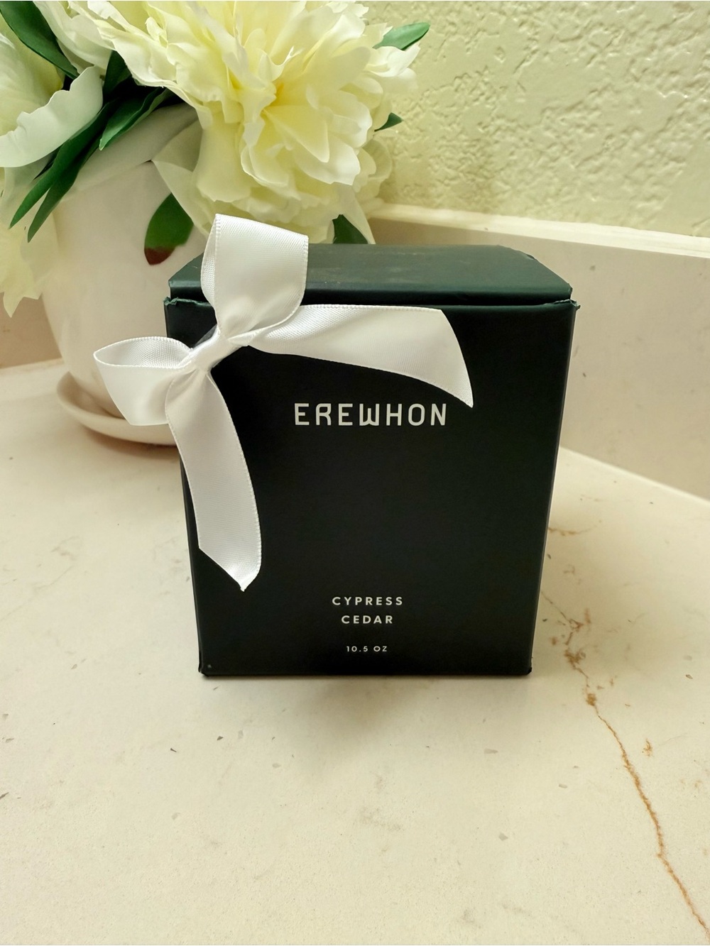 Erewhon Cypress Cedar Scented Candle in a Dark Green Box with White Bow